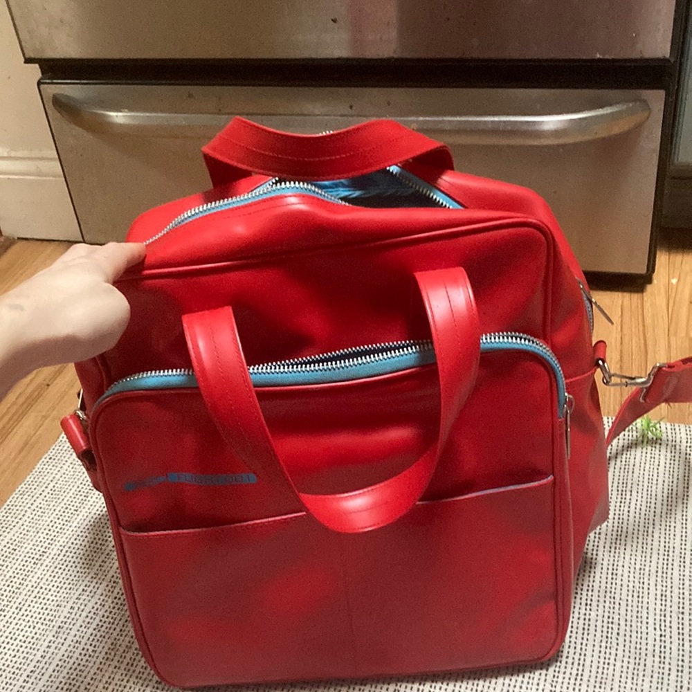 Flight 001 red leather bag